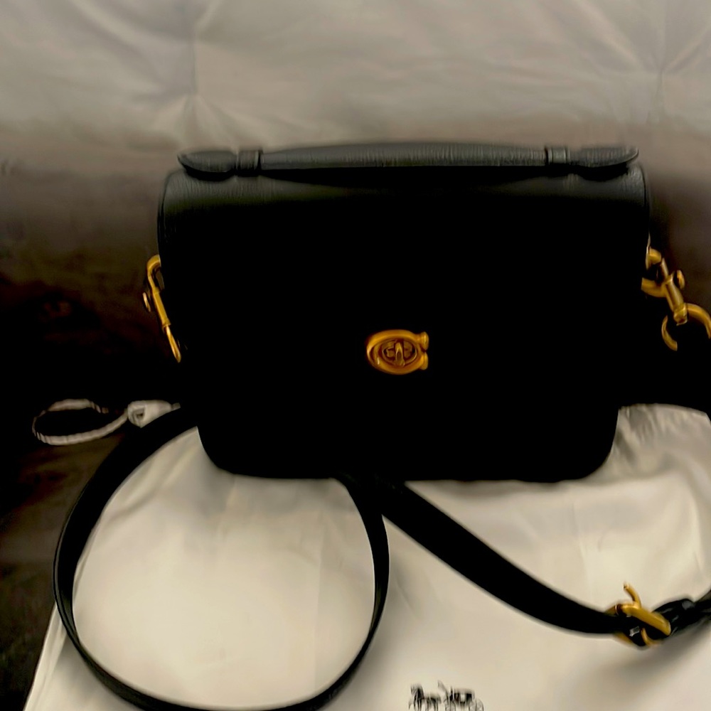 Coach large Cassie crossbody black  pebble leather. Brown lining Brass closure